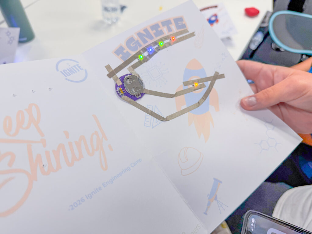 Little Engineers robotics project with LED lights on paper.