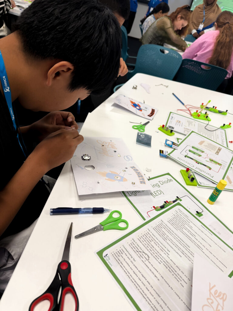Children engaging in STEM activities at Little Engineers workshop.