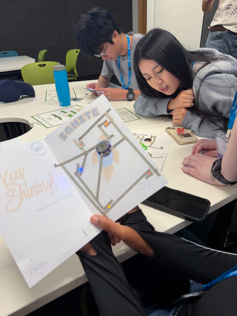 Children engaging in STEM activities at Little Engineers workshop.