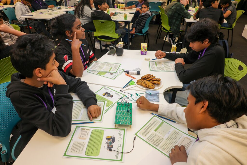 Children participating in a STEM workshop at Little Engineers event.