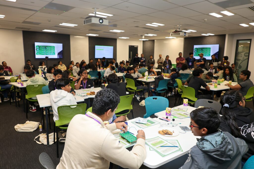 Students participating in a design challenge at UoA Open Day event.