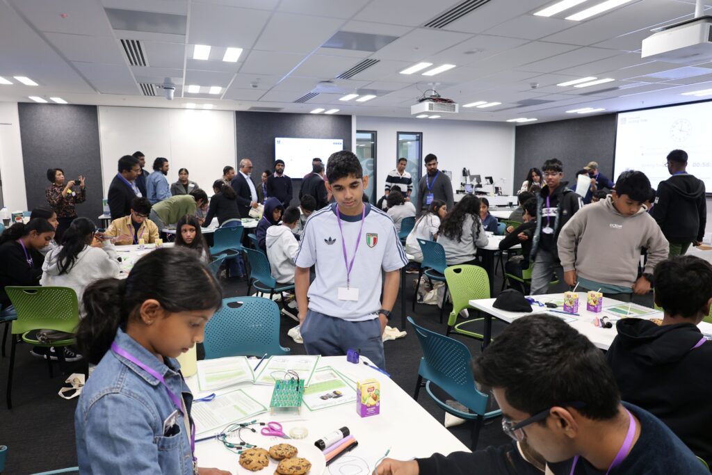 Students participating in a design challenge at UoA Open Day event.