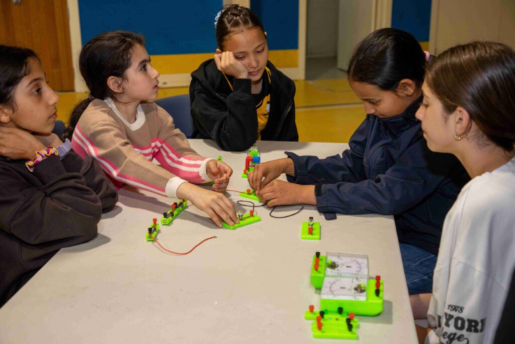 Young girls engaging in a hands-on electronics workshop at Little Engineers.