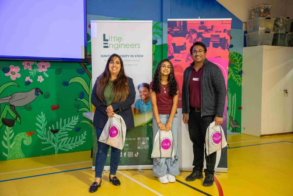 Young girls and man at Little Engineers electronics workshop event.