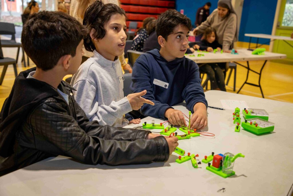 Children engaging in a hands-on electronics workshop at Little Engineers.
